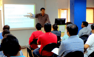 Lecture given in a UPSC coaching class with students seated in rows